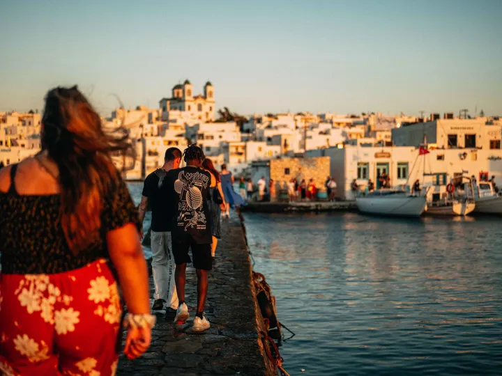 Young Group Of Travelers Exploring Greek Harbour