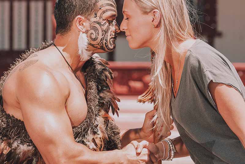 A man with tattoos and a woman