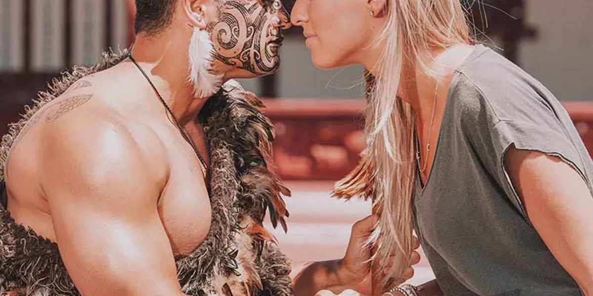 A man with tattoos and a woman