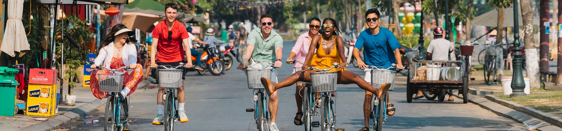 Group Riding Bikes Through Road In Vietnam