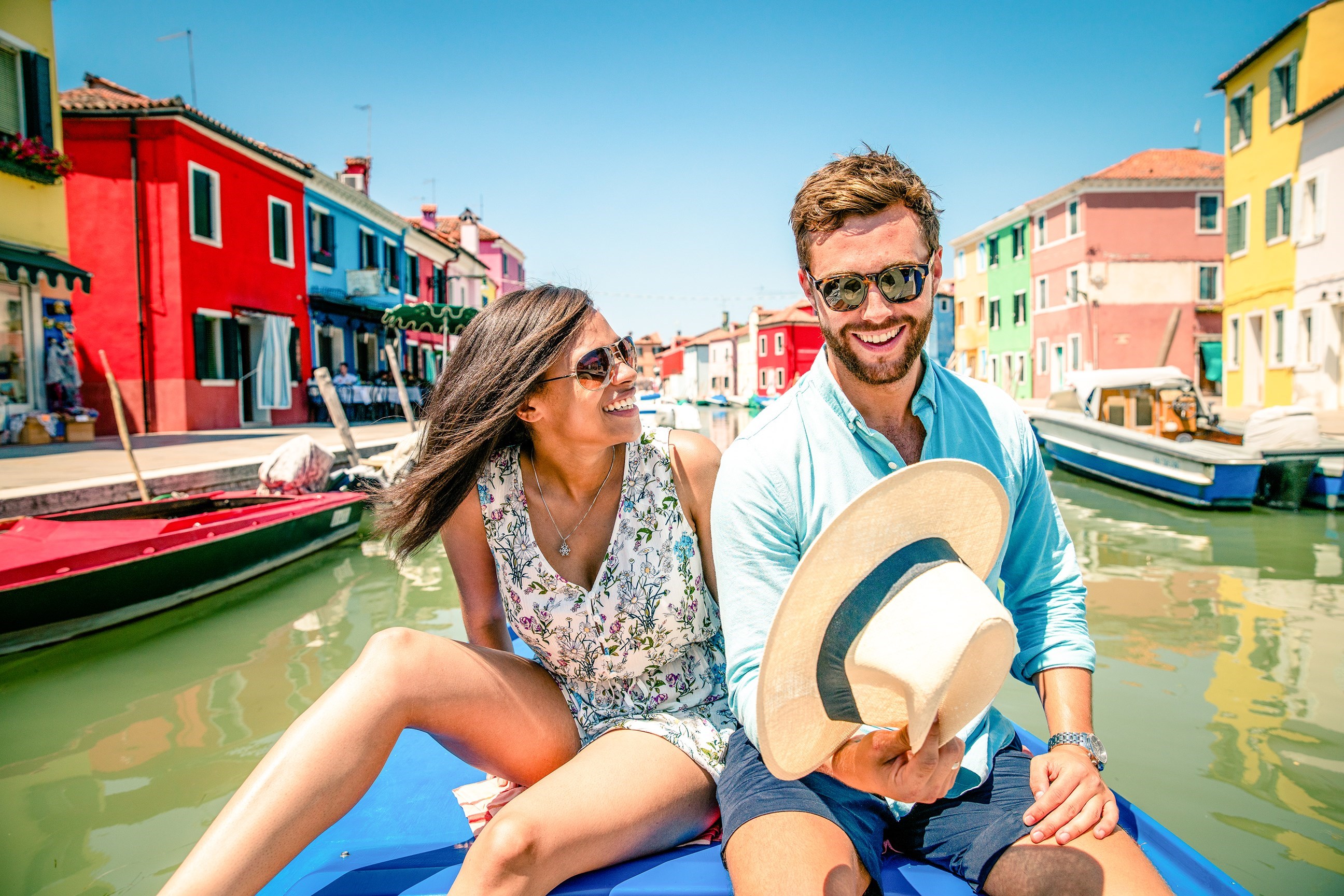 Travellers Taking a Boat Cruise on Canal through Burano, Italy