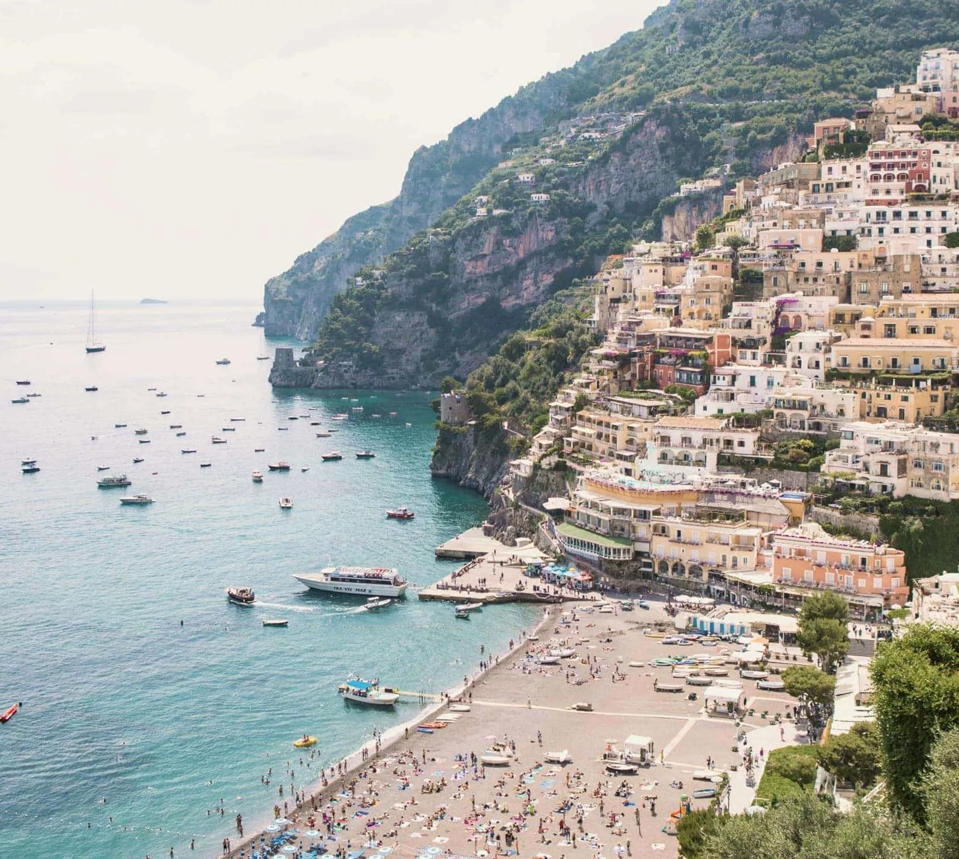 Panoramic view of Positano's colourful cliffside village and beach on the Amalfi Coast during the Contiki Amalfi Coast Tour