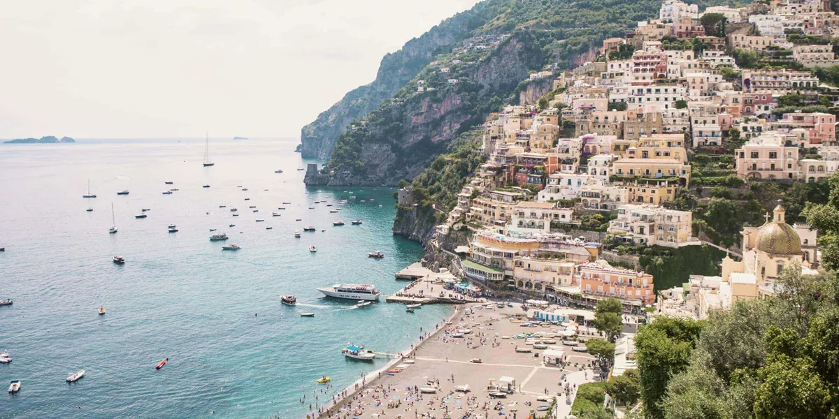 Panoramic view of Positano's colourful cliffside village and beach on the Amalfi Coast during the Contiki Amalfi Coast Tour