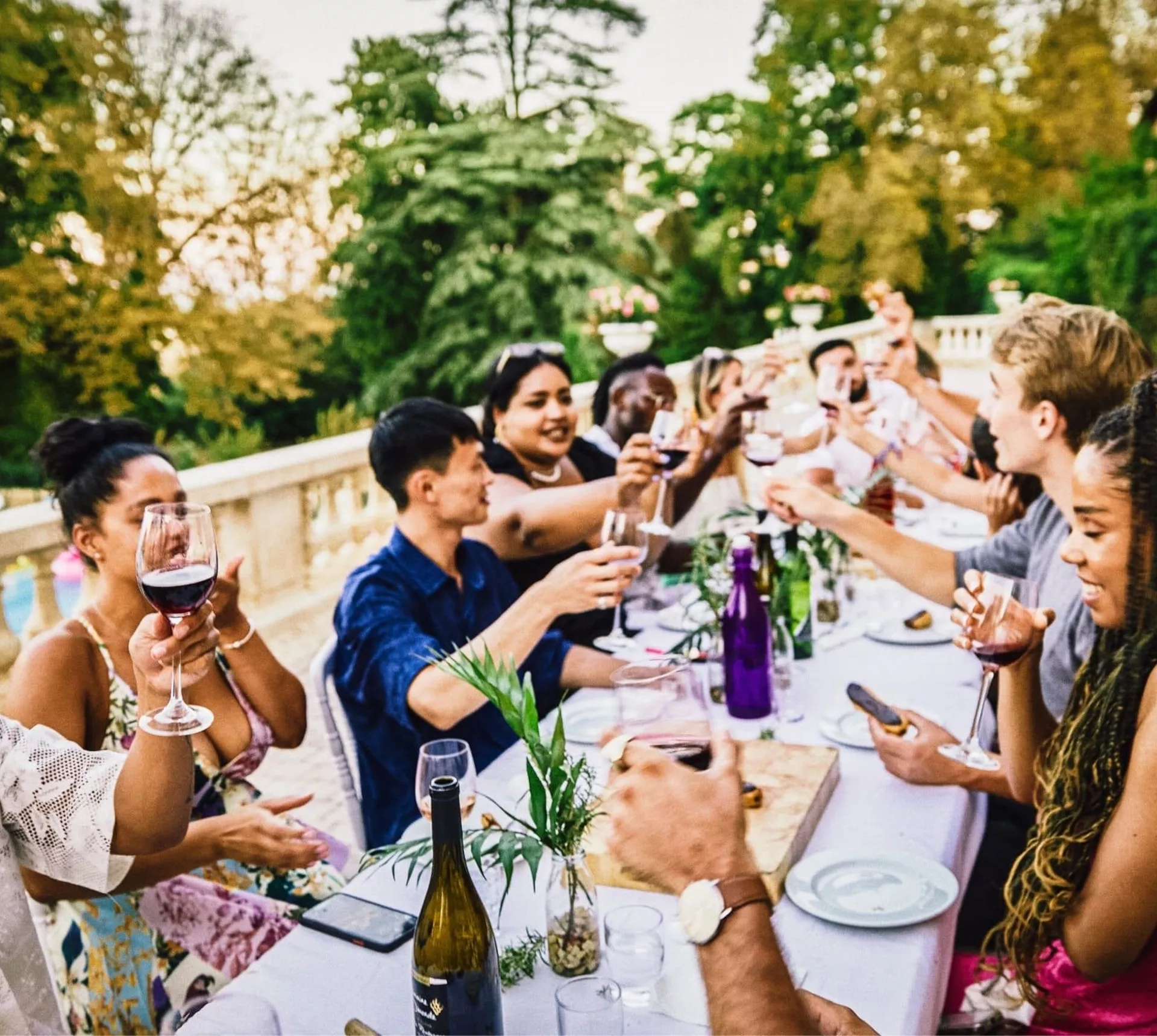 Travellers enjoying food and wine together at a French château on the Contiki Food & Wine in a French Château Tour