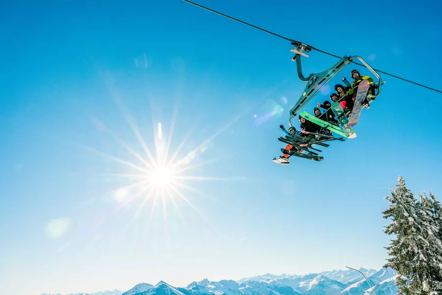 Group Of Skiers On Ski Left In The Sunshine