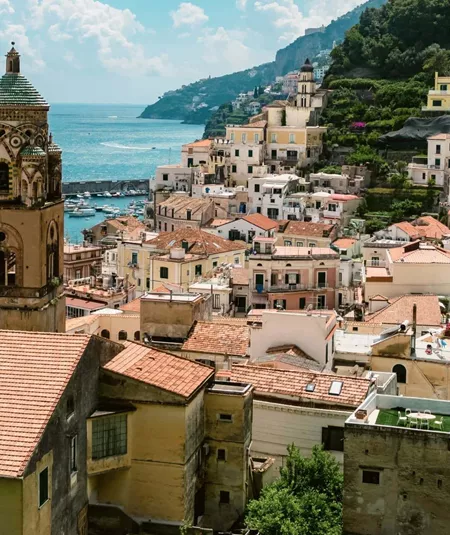 View over Amalfi, Italy, with the Cathedral of St. Andrew, colourful hillside buildings and the Tyrrhenian Sea.