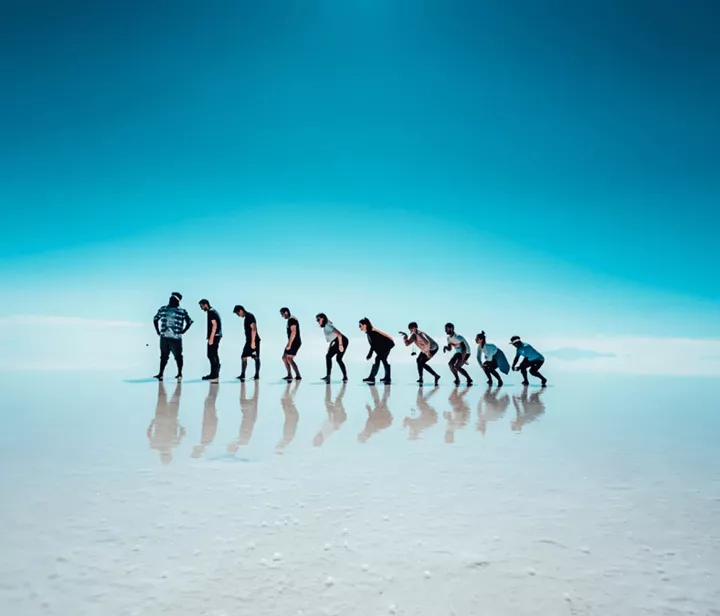 A group of people on a blue background