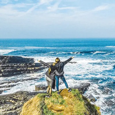 Woman enjoying natural landscape of United Kingdom