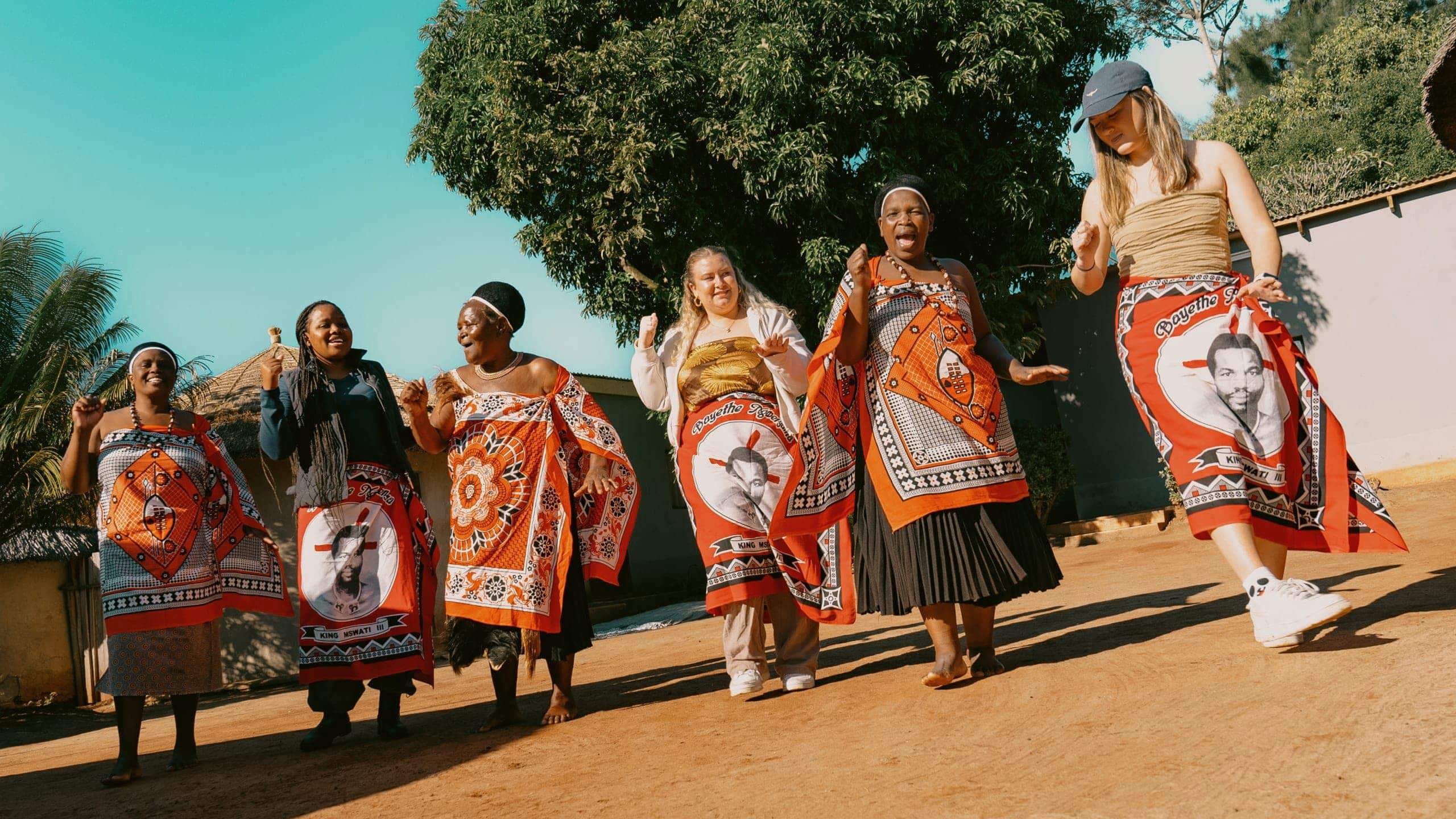 Group join a traditional Swazi dance performance with local community members - Contiki Kruger & Eswatini Safari Tour