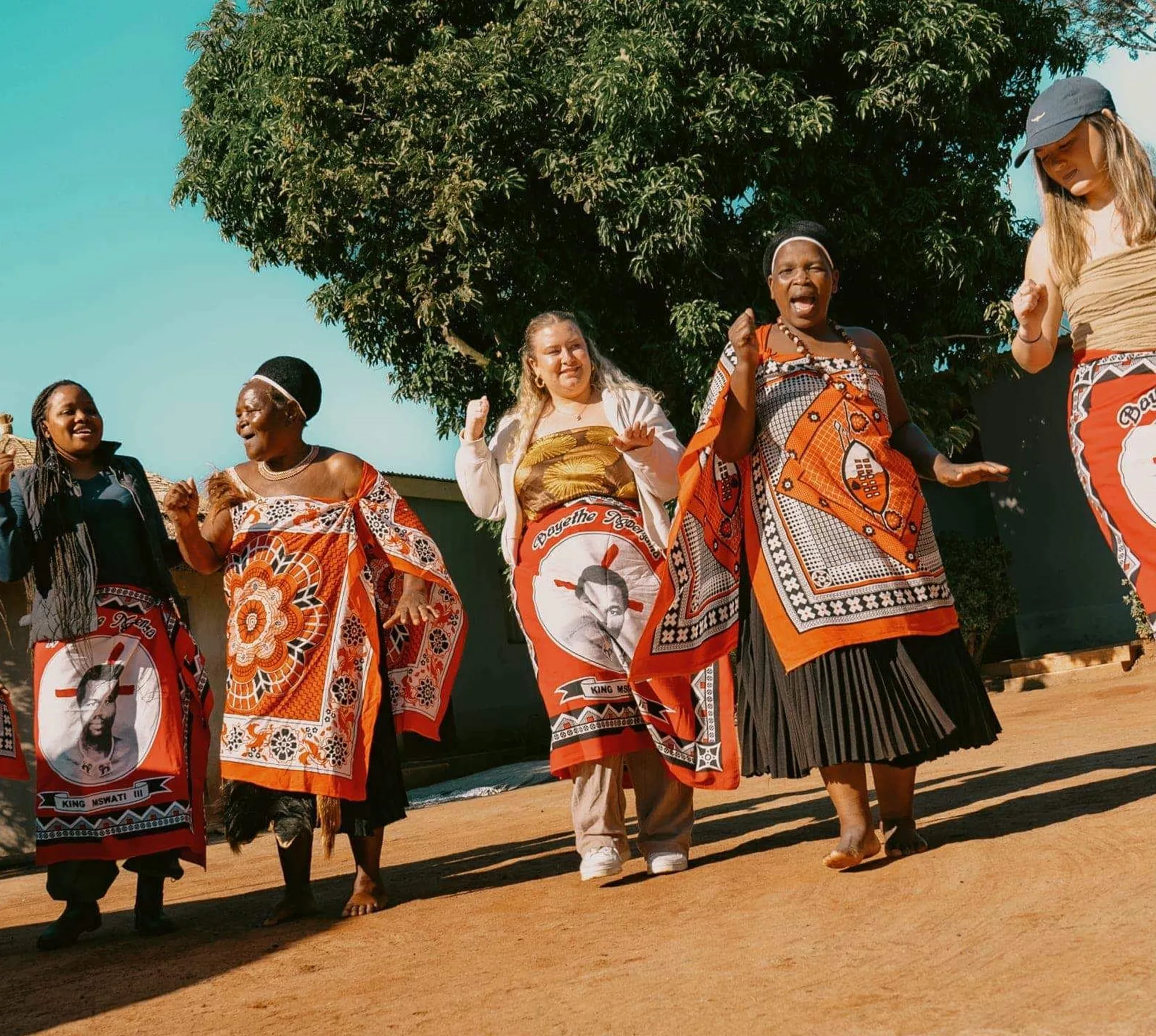 Group join a traditional Swazi dance performance with local community members - Contiki Kruger & Eswatini Safari Tour