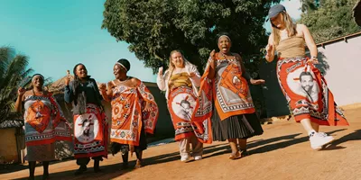 Group join a traditional Swazi dance performance with local community members - Contiki Kruger & Eswatini Safari Tour