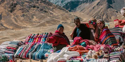 Travellers discovering traditional Andean textiles - Contiki Peru Panorama Tour