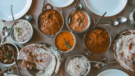 Table with various traditional local Asian dishes