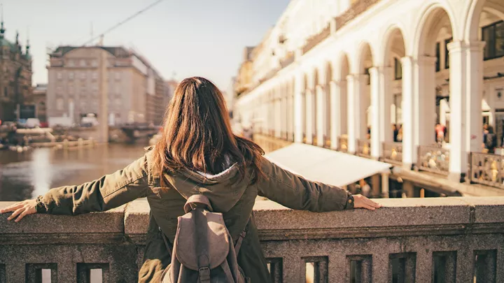 Traveller stood on a bridge in Hamburg, Germany