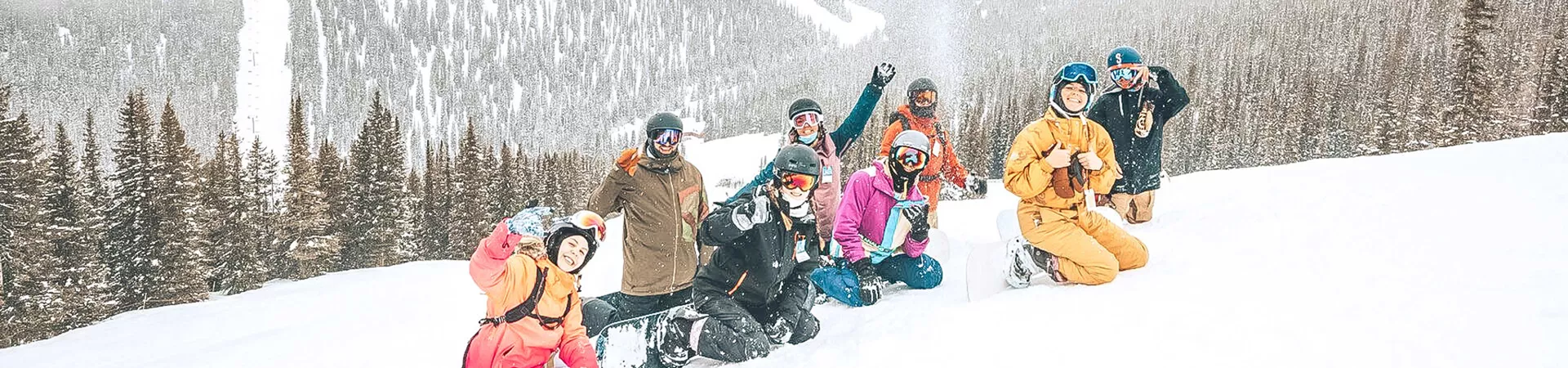 People Enjoying A Day Of Snow Snowy Mountains At The Back