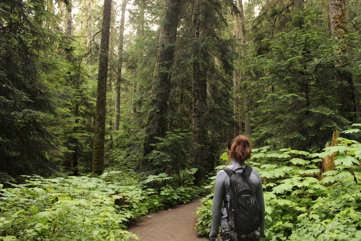 Young woman hiking in Joffre Lakes Provincial Park in Vancouver, Canada.