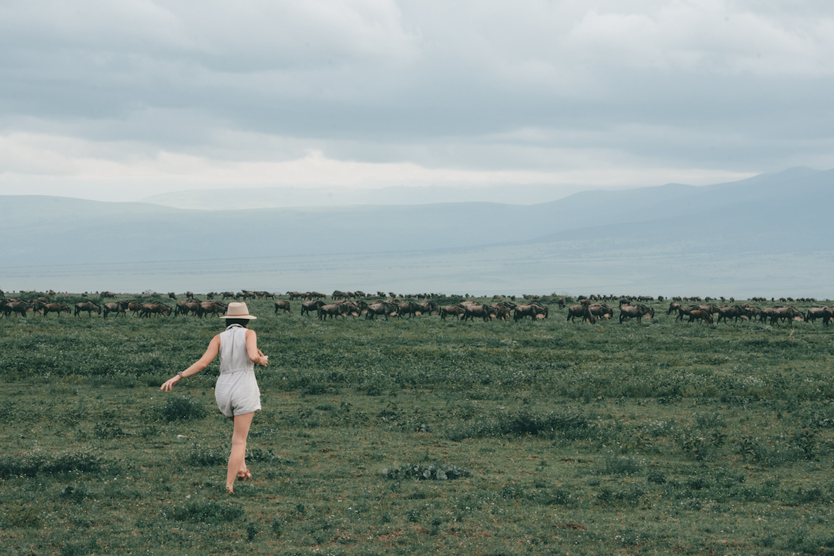 Woman walking in the Serengeti National Park, Tanzania.