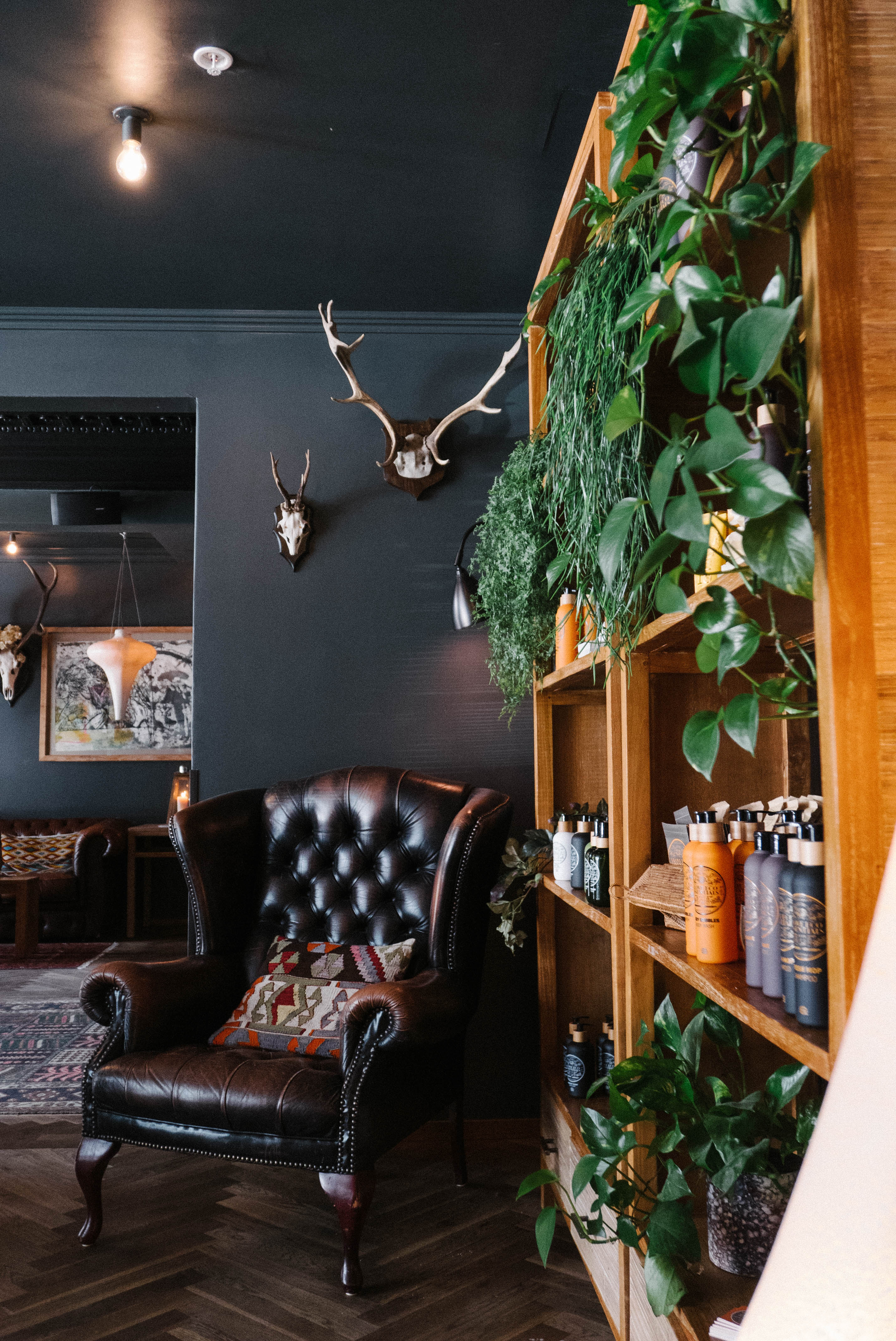 Black armchair in a black room.