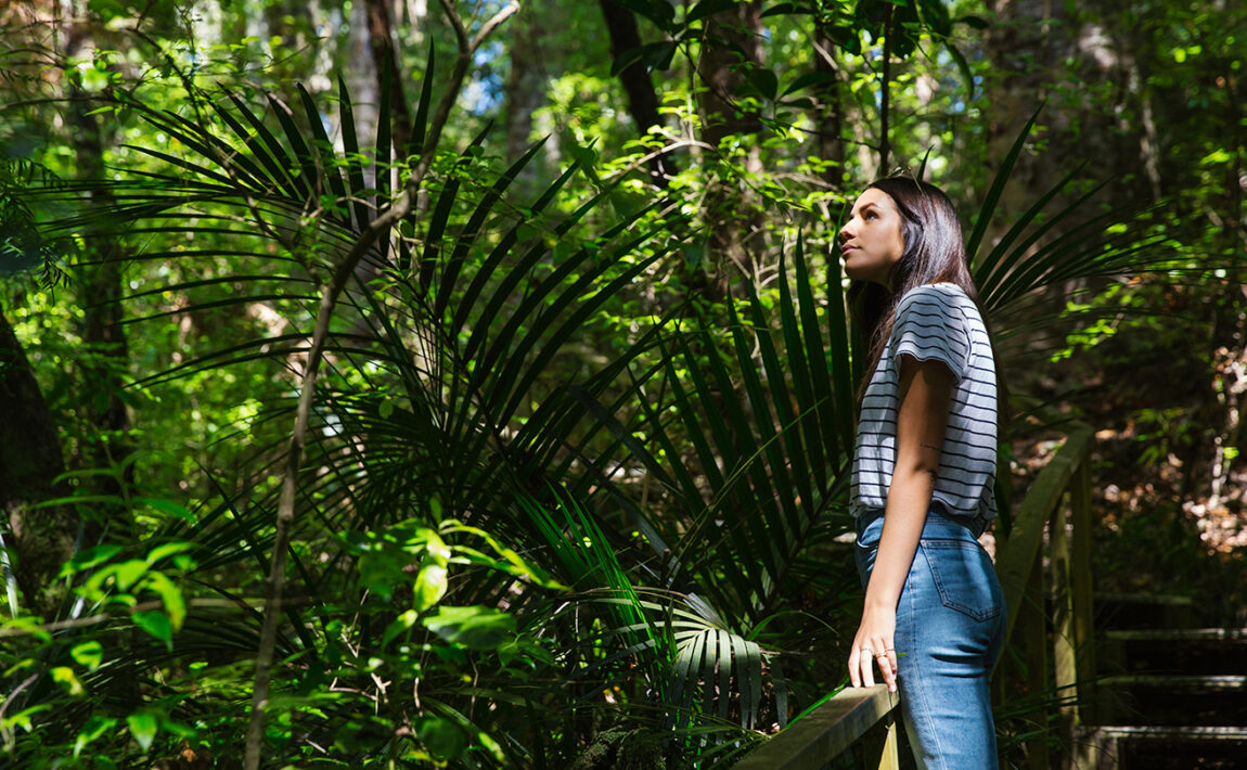 Girl-surrounded-by-fauna-in-New-Zealand
