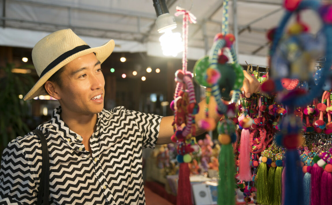 Man shopping for souvenirs in Asia