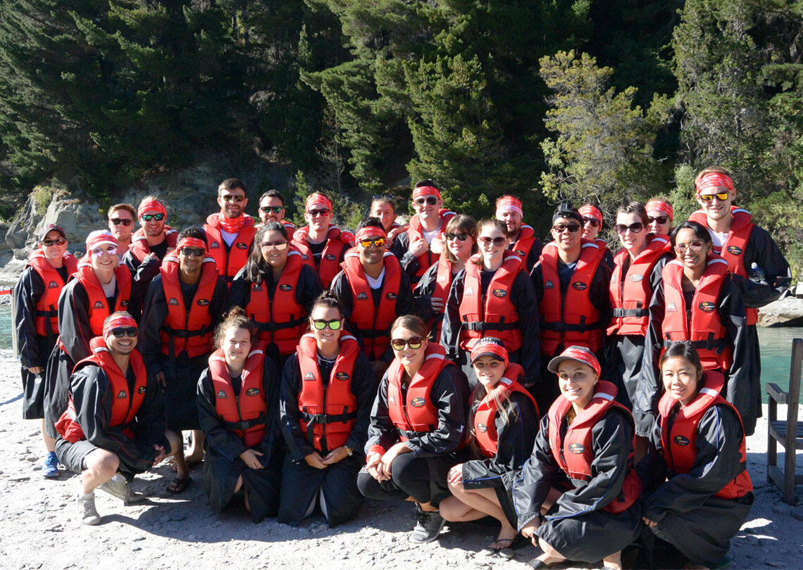 A group of people in life jackets posing for a photo in New Zealand.