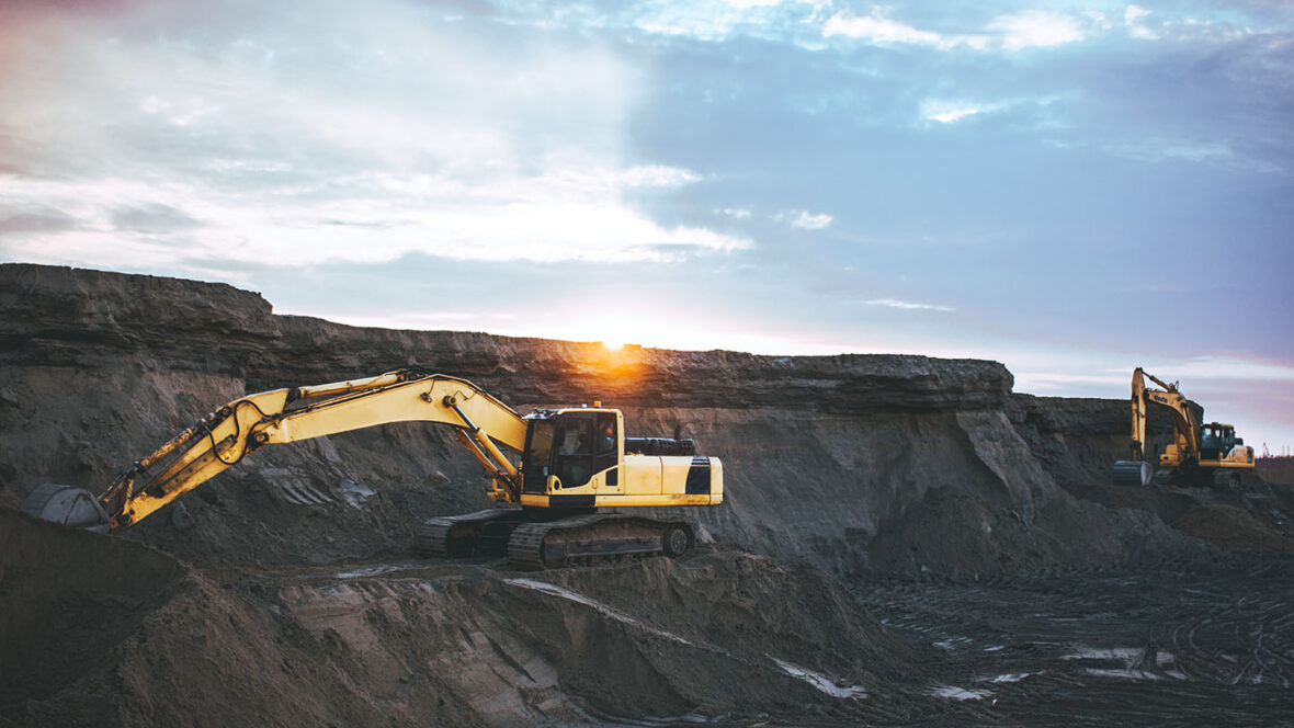 Coal diggers mining on a coal plant