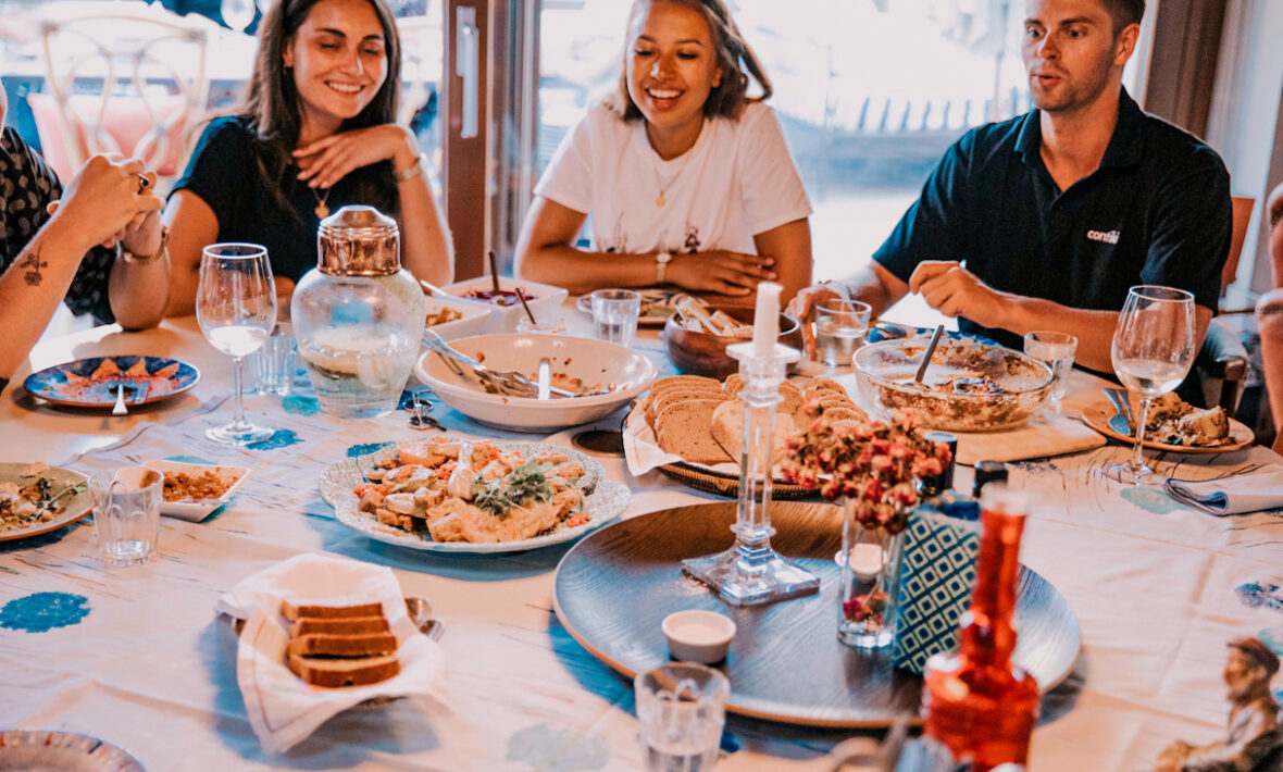 Friends eating together, Portugal