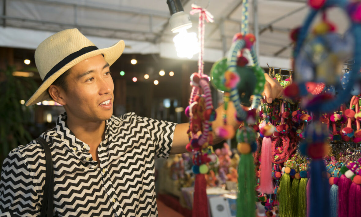 Man shopping for souvenirs in Asia