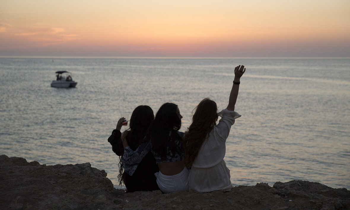 3-girls-on-cliff-in-Ibiza-sunset