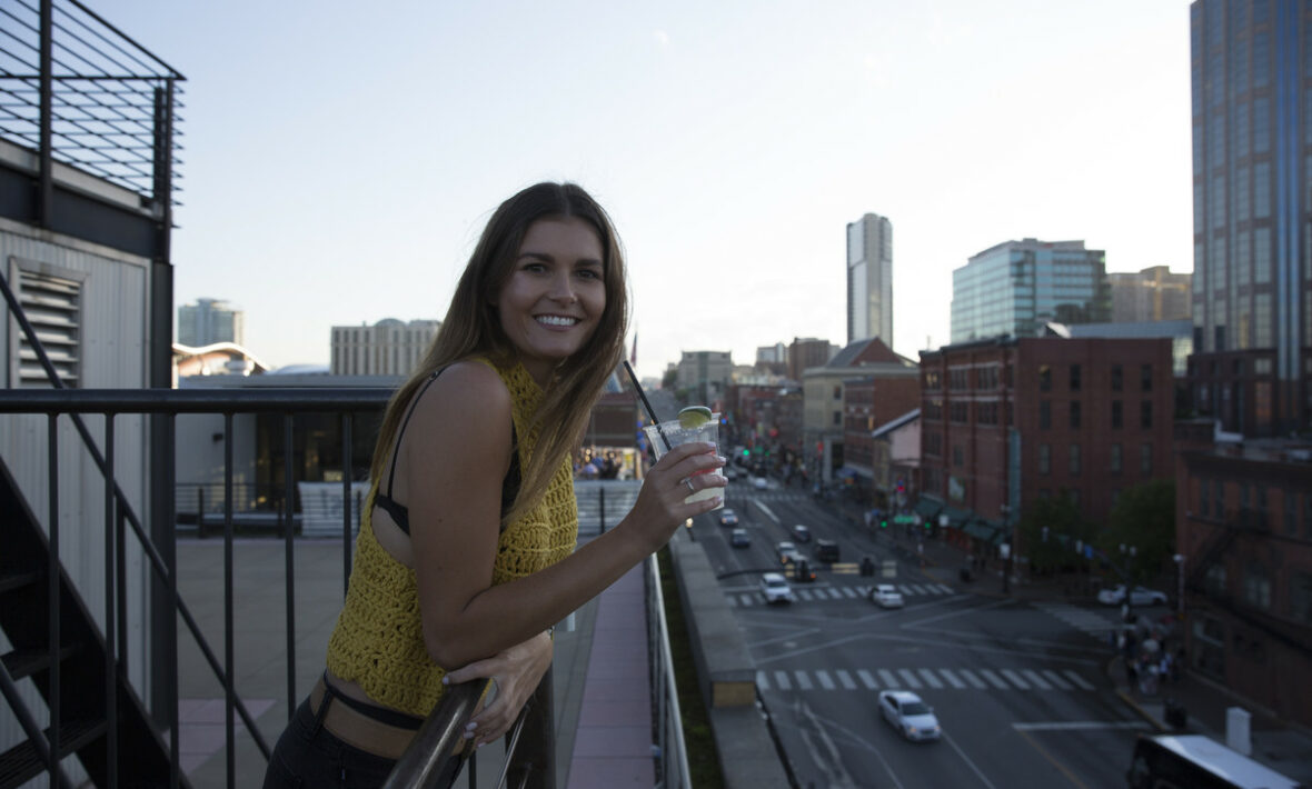 girl leaning on balcony