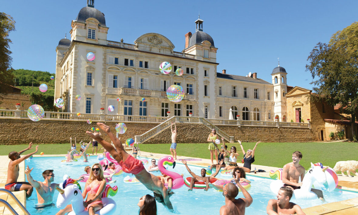 A group of people enjoying holiday hacks in a pool.