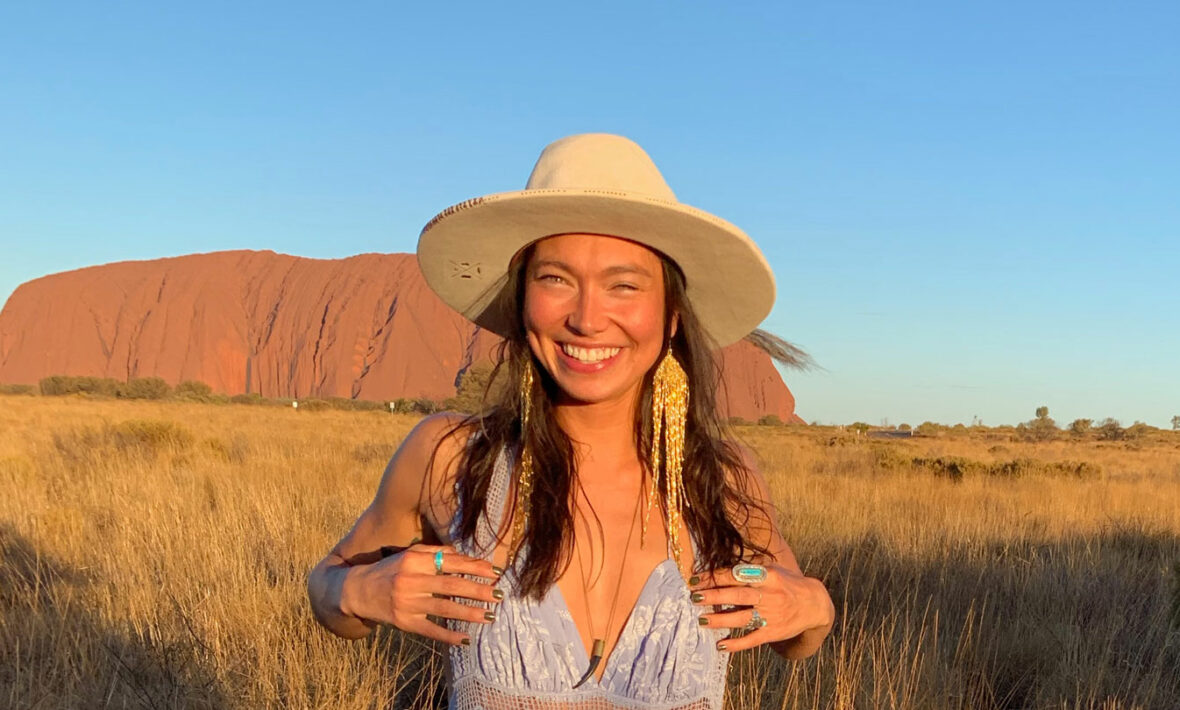 Sarain Fox posing in front of Uluru.