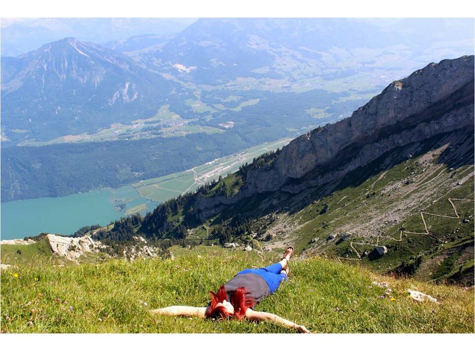 Girl lying down in mountains