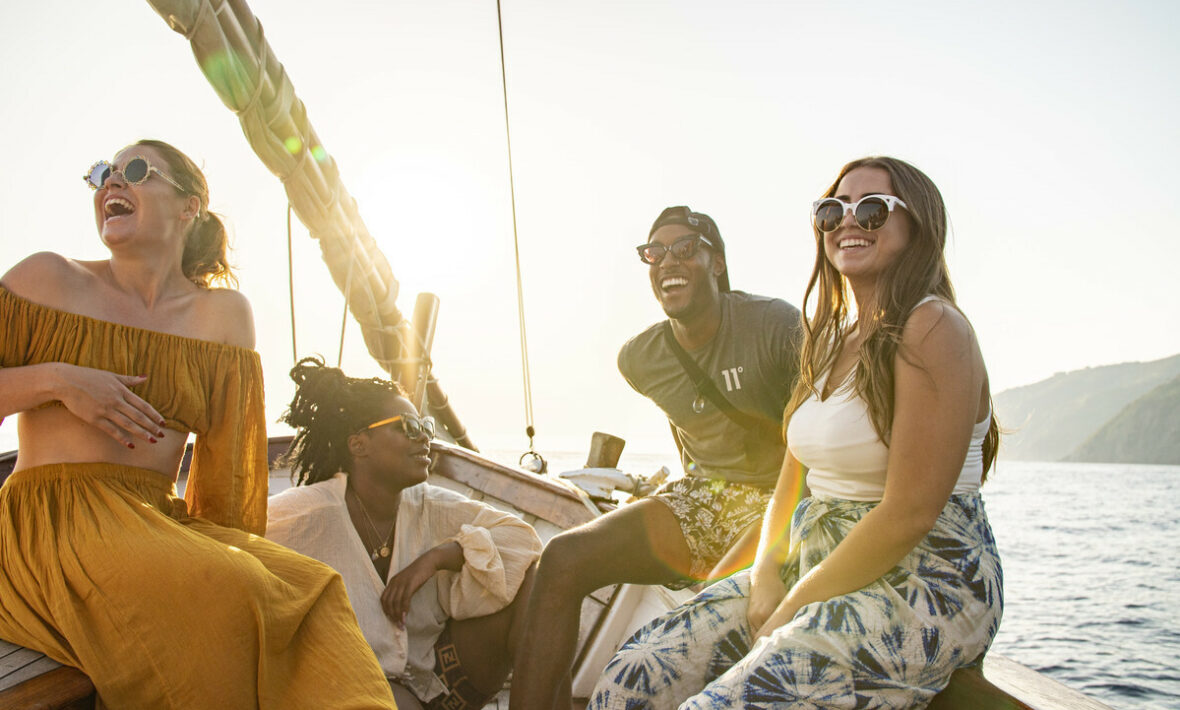 A group of people on a Contiki boat trip in the ocean.