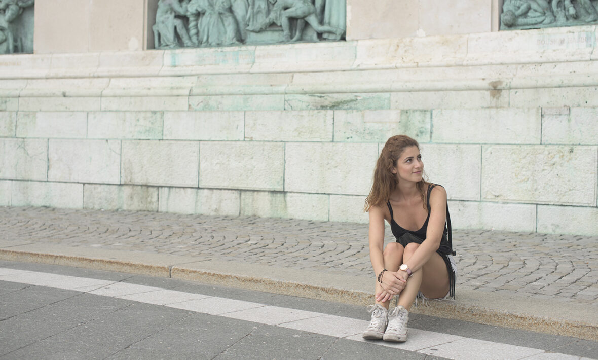 Girl-sitting-on-pavement