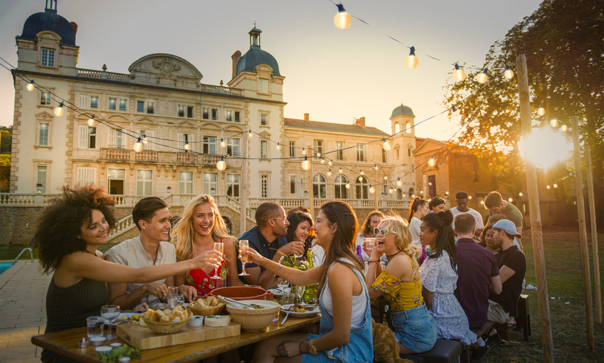 Contiki Chateau, group of friends eating and drinking at dusk