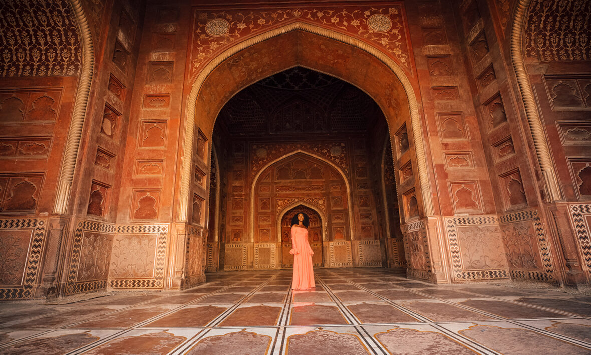 A woman in an ornate building.