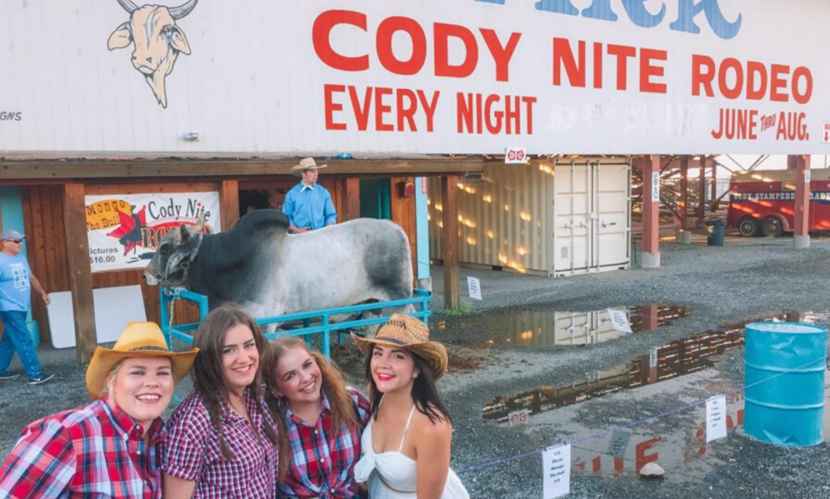 Four girls outside a rodeo venue in Cody, Wyoming