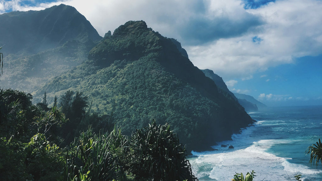 An enchanting ocean view from a hillside in Hawaii, perfect for those with a passion for travel.