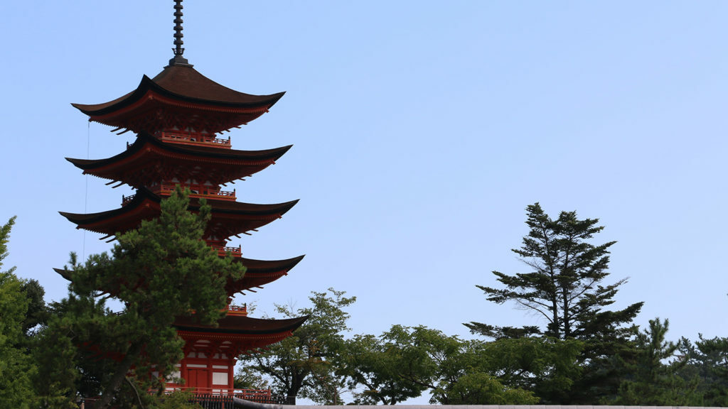 A pagoda tower in a park captured in travel videos.