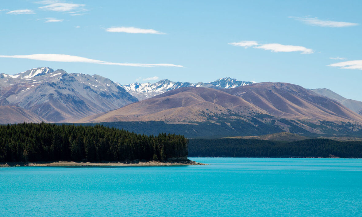 A serene lake surrounded by majestic mountains in Covid-19 free New Zealand.