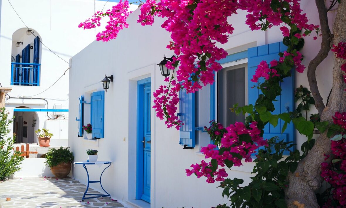 white house with blue windows in antiparos, greece