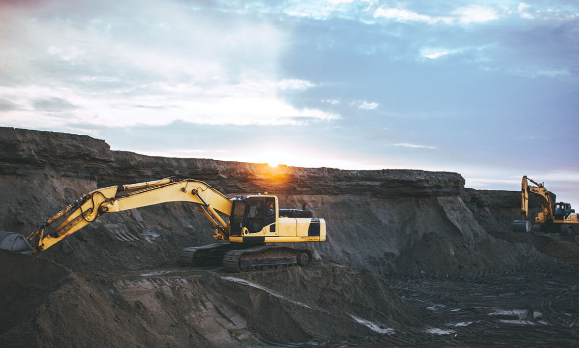 Coal diggers mining on a coal plant