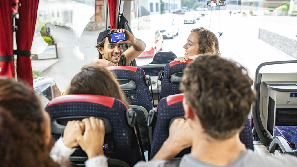 A group of people on a bus traveling.