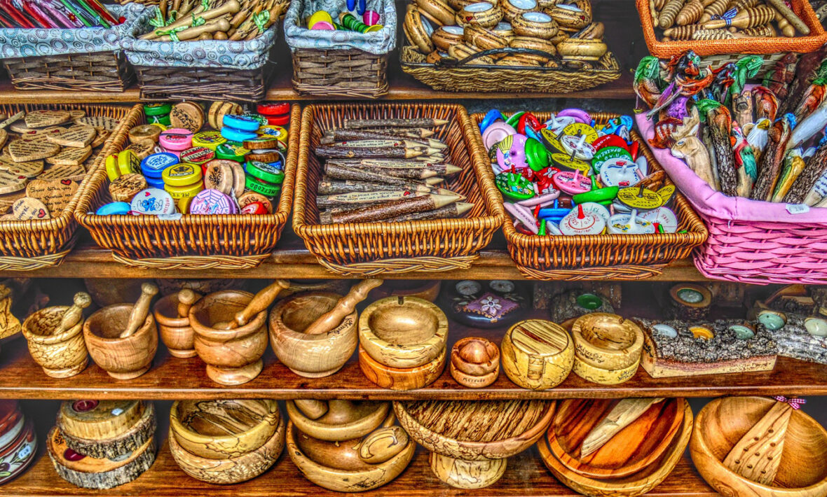 A wooden shelf with a variety of items on it.