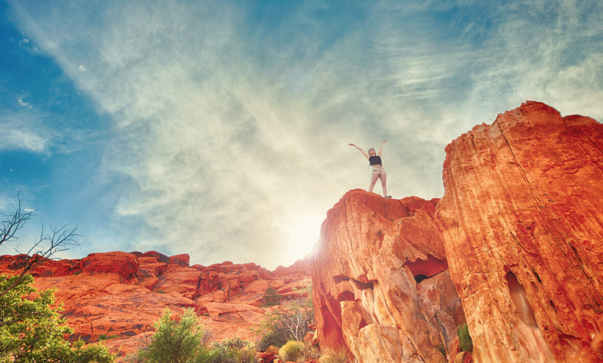 sustainability - image of a girl standing on a rock