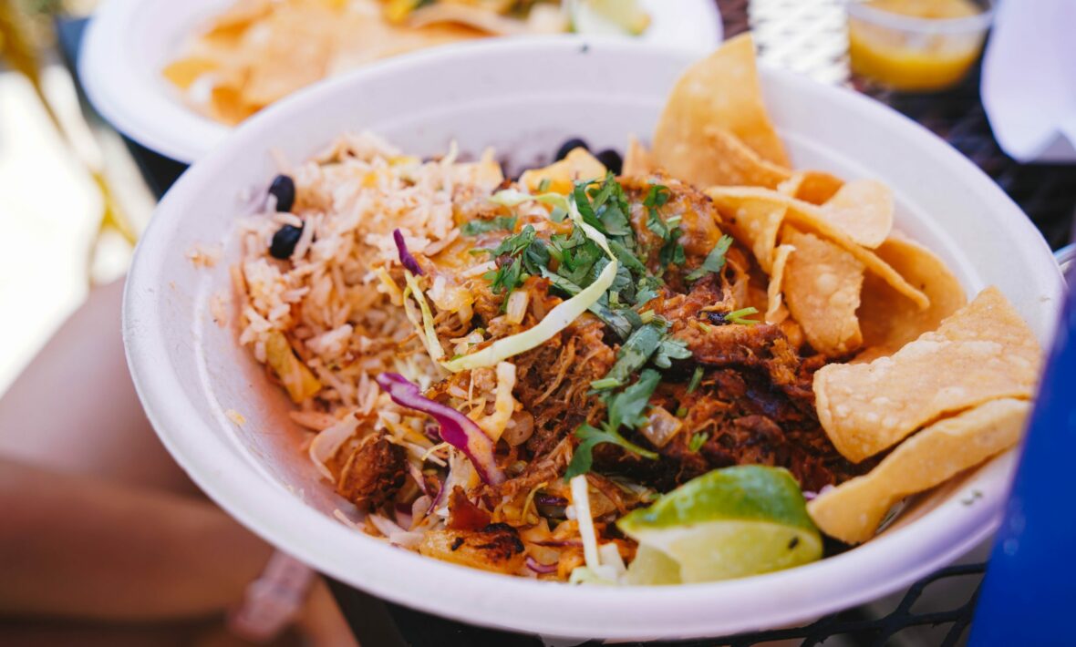 A bowl of Mexican food, known for being the best in Costa Rica, sitting on a table.