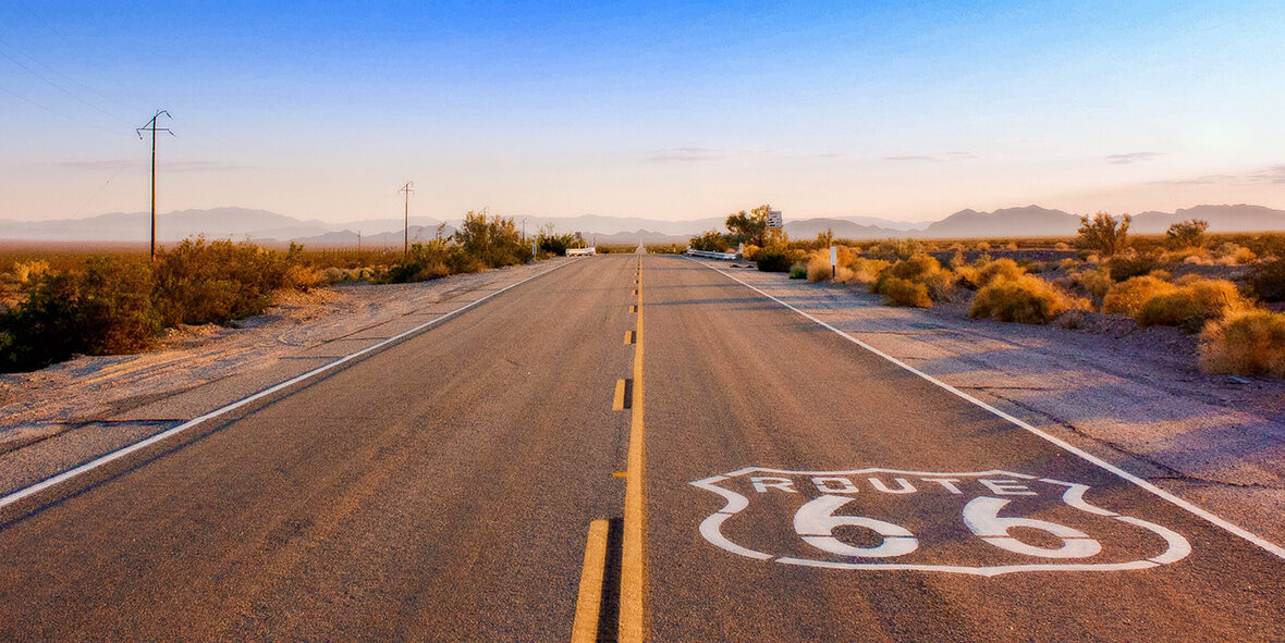 An empty road with a LA sign painted on it.