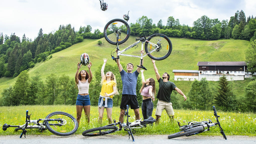 A group of people posing with their bicycles, showcasing things to do in Austria.