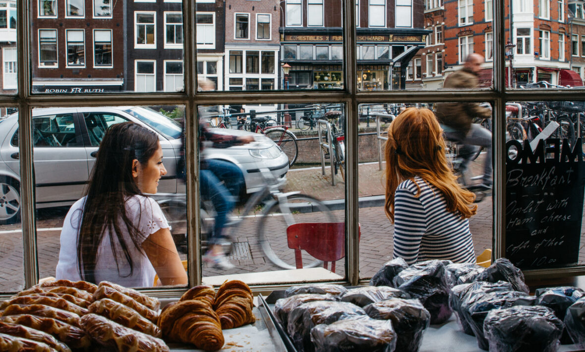 travel photography - girls outside cafe in amsterdam